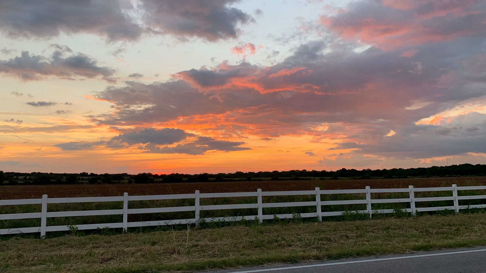 Pasture fence at sunset near Magnolia, TX