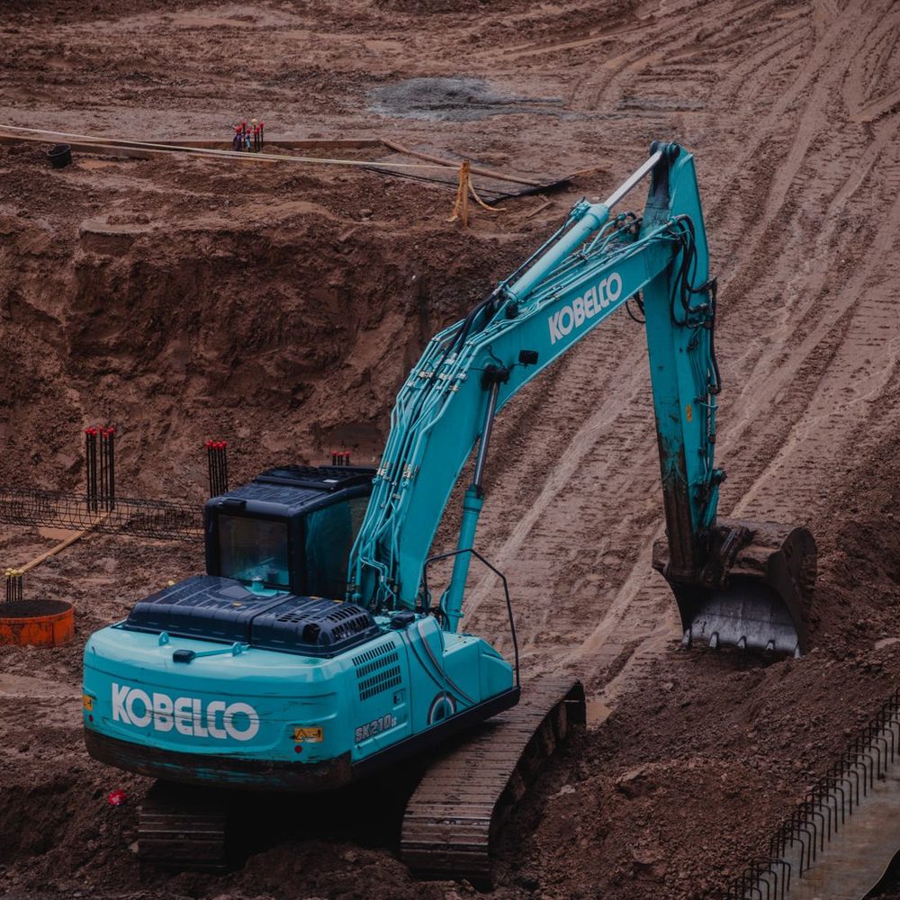 Excavator digging on a commercial site