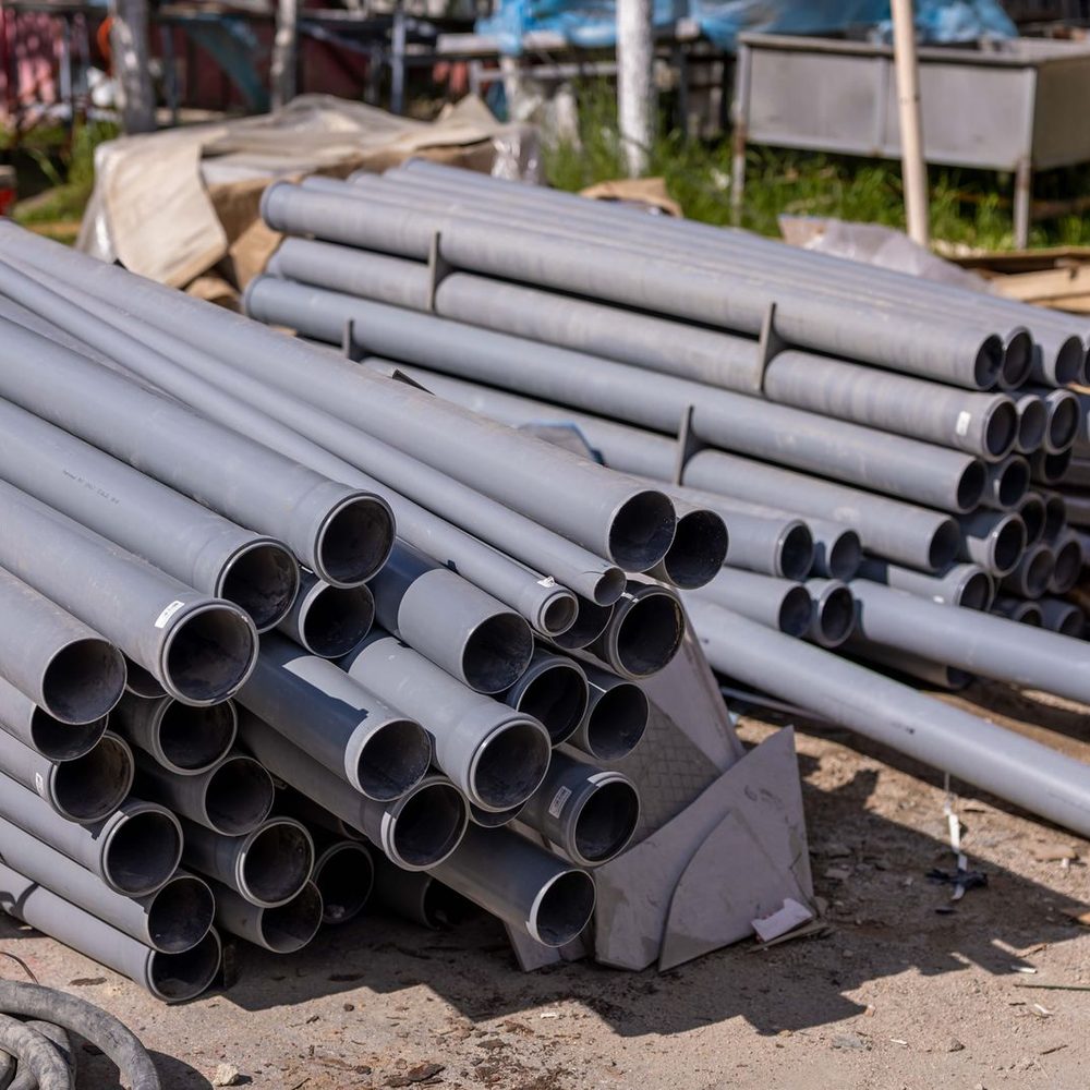 Stack of PVC pipe on a job site